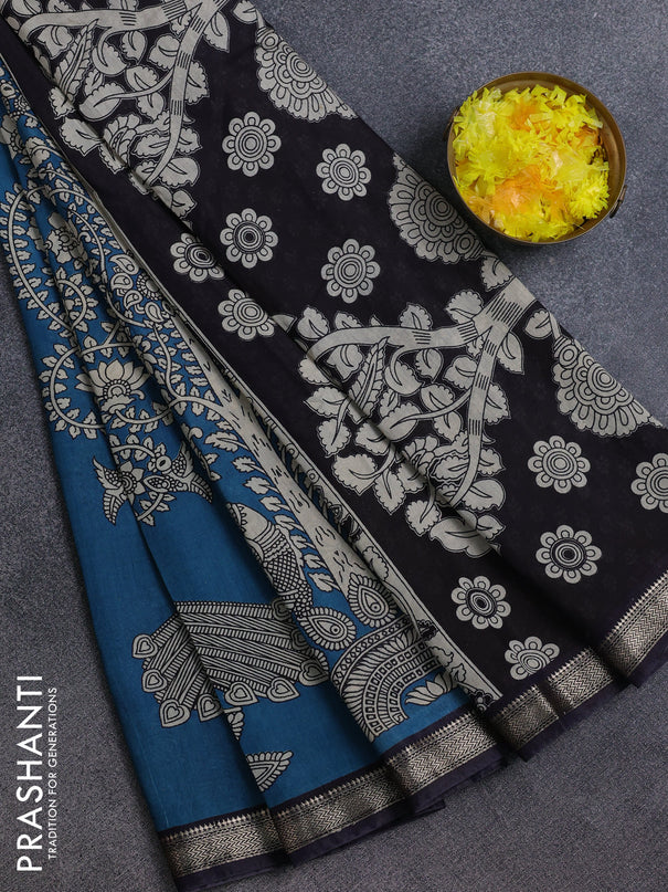 Muslin silk saree cs blue and black with allover kalamkari prints and zari woven border