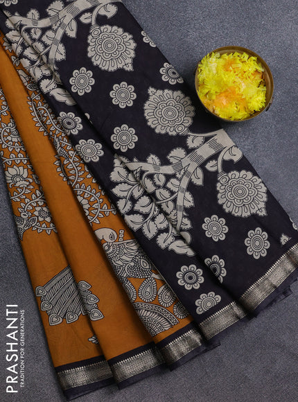 Muslin silk saree dark mustard and black with allover kalamkari prints and zari woven border