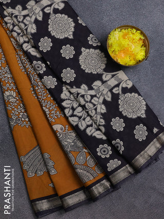 Muslin silk saree dark mustard and black with allover kalamkari prints and zari woven border