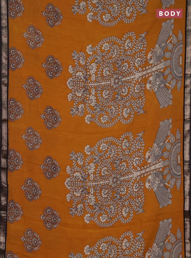 Muslin silk saree dark mustard and black with allover kalamkari prints and zari woven border