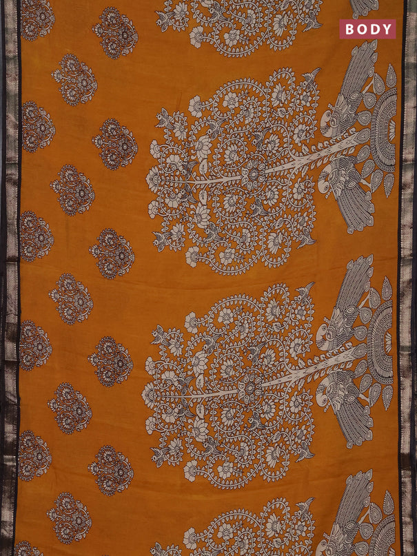 Muslin silk saree dark mustard and black with allover kalamkari prints and zari woven border