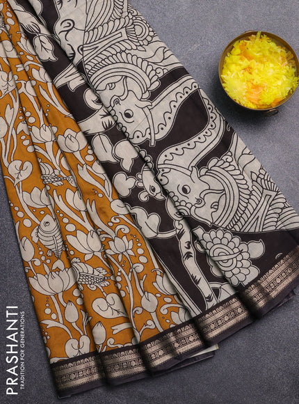 Muslin silk saree mustard yellow and black with allover kalamkari prints and zari woven border