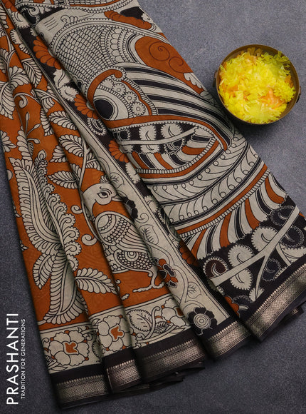 Muslin silk saree mustard yellow and black with allover kalamkari prints and zari woven border