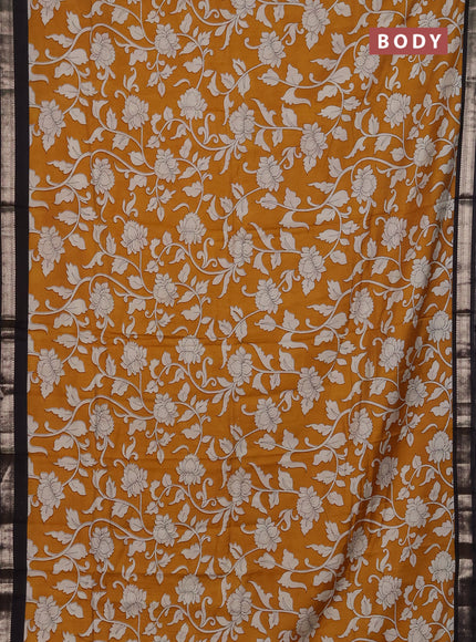 Muslin silk saree mustard yellow and black with allover kalamkari prints and zari woven border