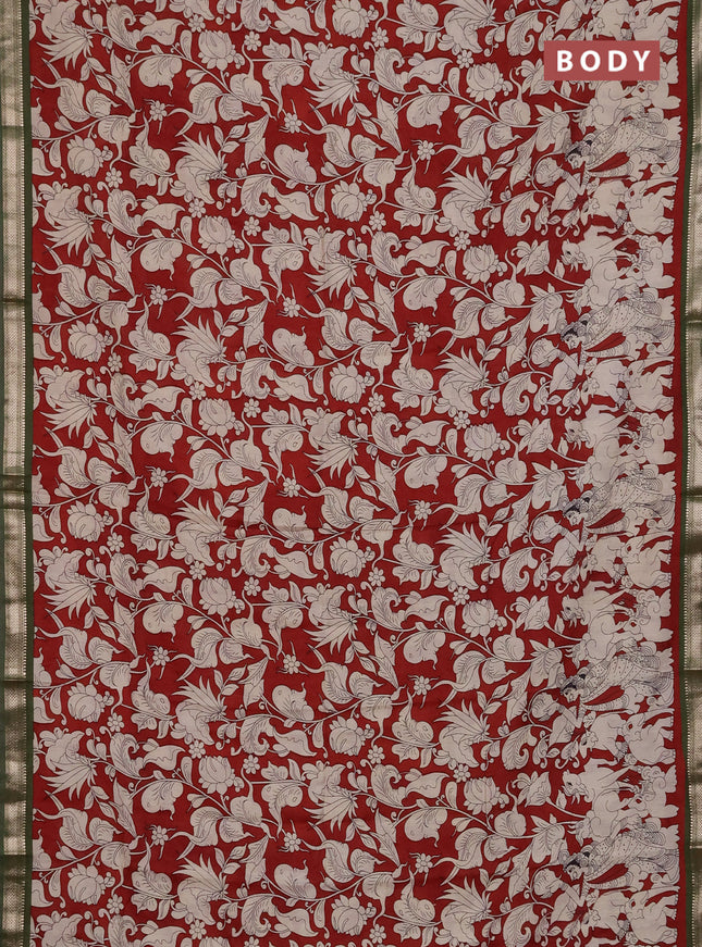 Muslin silk saree rust shade and mehendi green with allover kalamkari prints and zari woven border