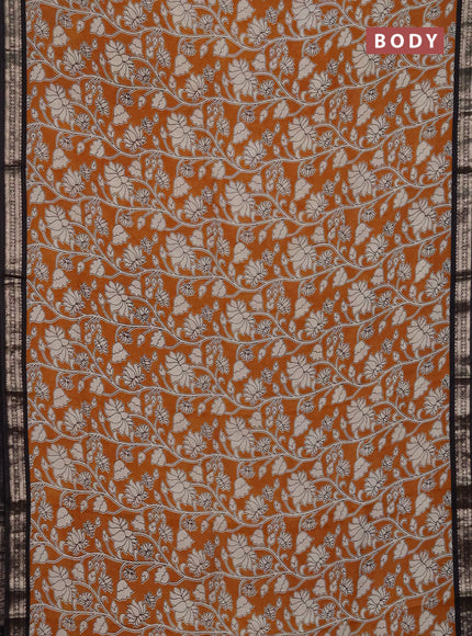 Muslin silk saree dark mustard and black with allover kalamkari prints and zari woven border