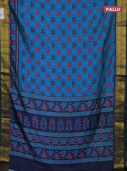 Semi tussar saree dual shade of bluish green and green with allover ikat prints and zari woven border