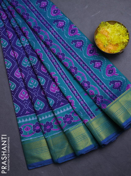 Semi tussar saree blue and teal green with allover ikat prints and zari woven border