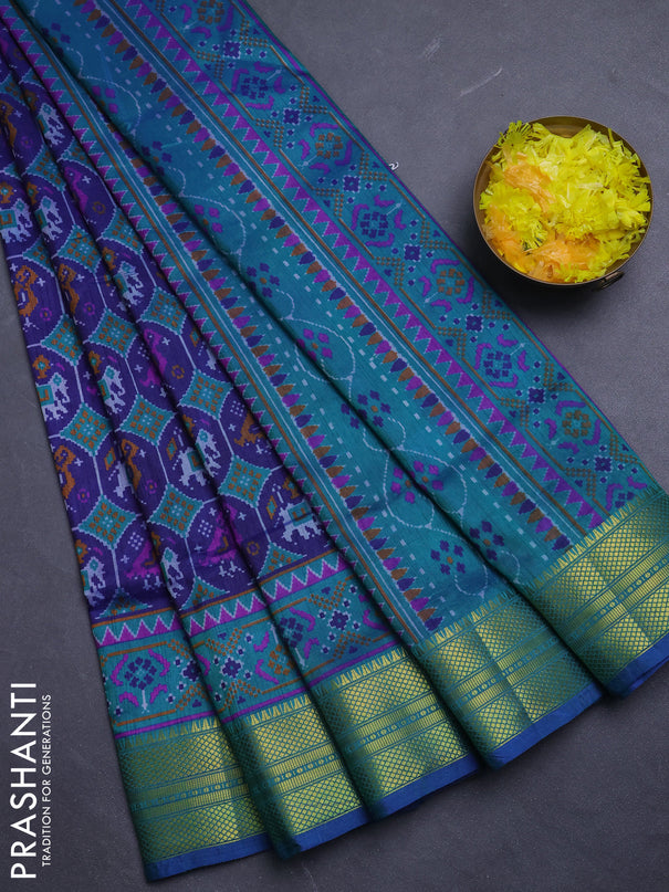 Semi tussar saree dark blue and teal green with allover patola prints and zari woven border