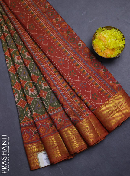 Semi tussar saree mehendi green and rust shade with allover patola prints and zari woven border