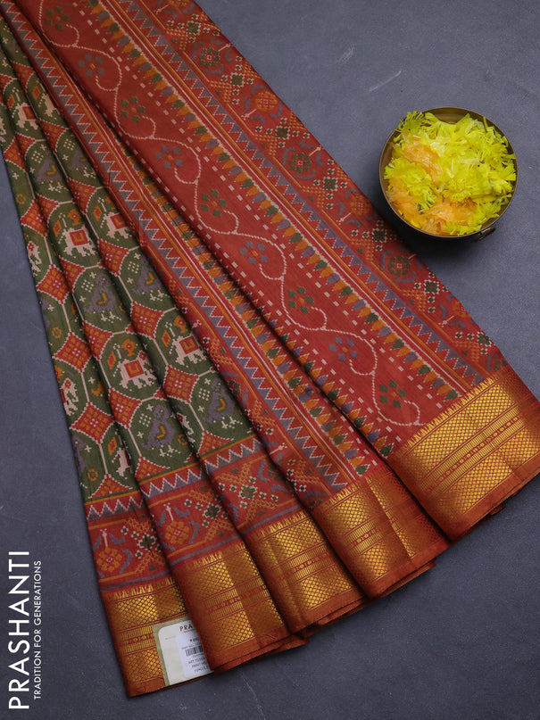 Semi tussar saree mehendi green and rust shade with allover patola prints and zari woven border