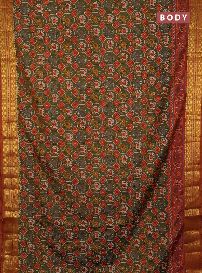 Semi tussar saree mehendi green and rust shade with allover patola prints and zari woven border