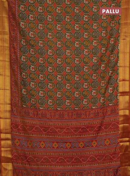Semi tussar saree mehendi green and rust shade with allover patola prints and zari woven border