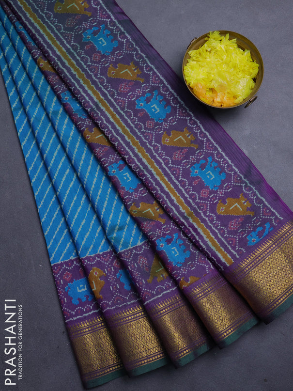 Semi tussar saree dual shade of bluish green and purple with allover leheriya style ikat weaves and zari woven border