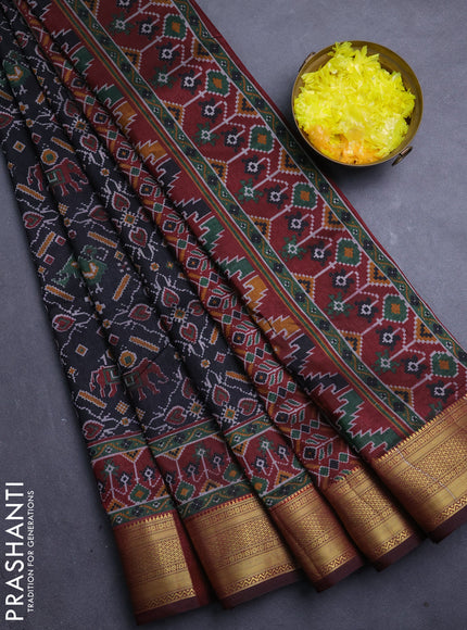 Semi tussar saree black and maroon with allover ikat prints and zari woven border