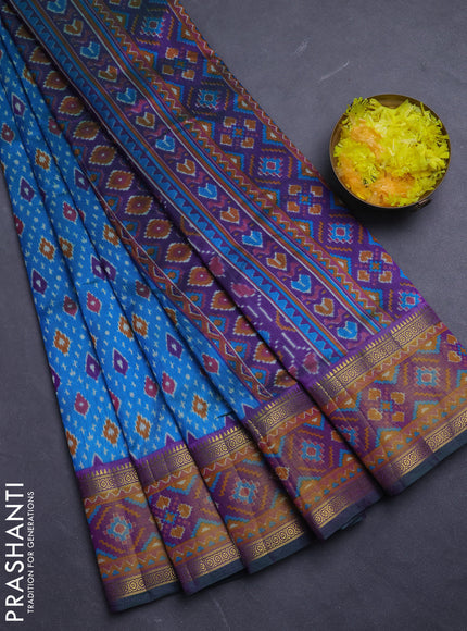 Semi tussar saree dual shade of bluish green and purple with allover ikat prints and ikat woven zari border