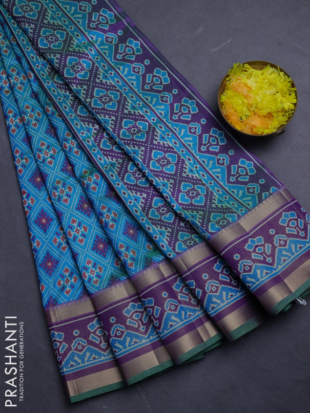 Semi tussar saree dual shade og bluish green and purple with allover ikat prints and ikat woven zari border