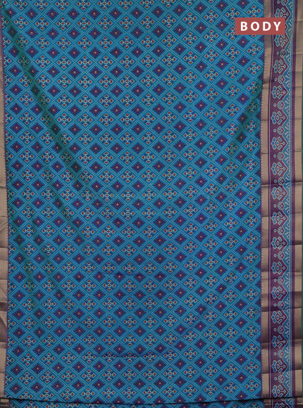 Semi tussar saree dual shade og bluish green and purple with allover ikat prints and ikat woven zari border