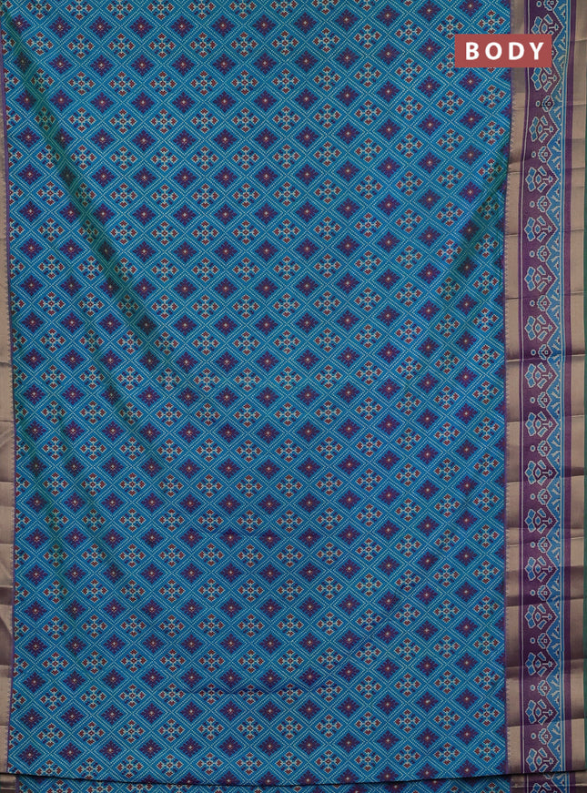 Semi tussar saree dual shade og bluish green and purple with allover ikat prints and ikat woven zari border