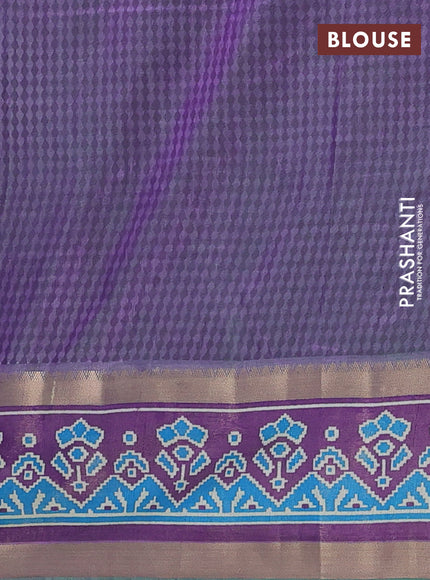 Semi tussar saree dual shade og bluish green and purple with allover ikat prints and ikat woven zari border