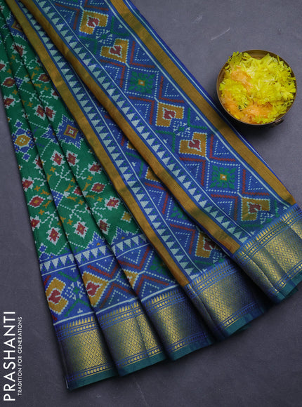 Semi tussar saree green with allover ikat prints and zari woven border