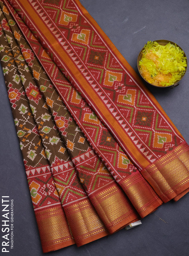 Semi tussar saree dark mustard and orange with allover ikat prints and zari woven border