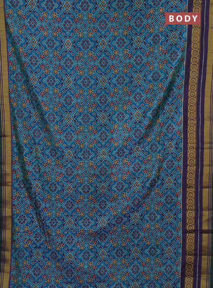 Semi tussar saree dual shade of bluish green and purple with allover ikat prints and ikat woven zari border