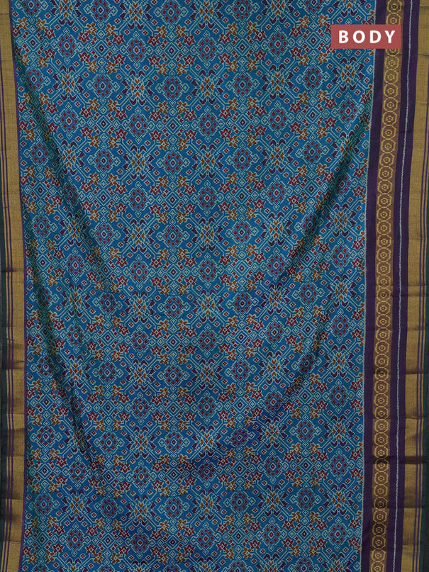 Semi tussar saree dual shade of bluish green and purple with allover ikat prints and ikat woven zari border