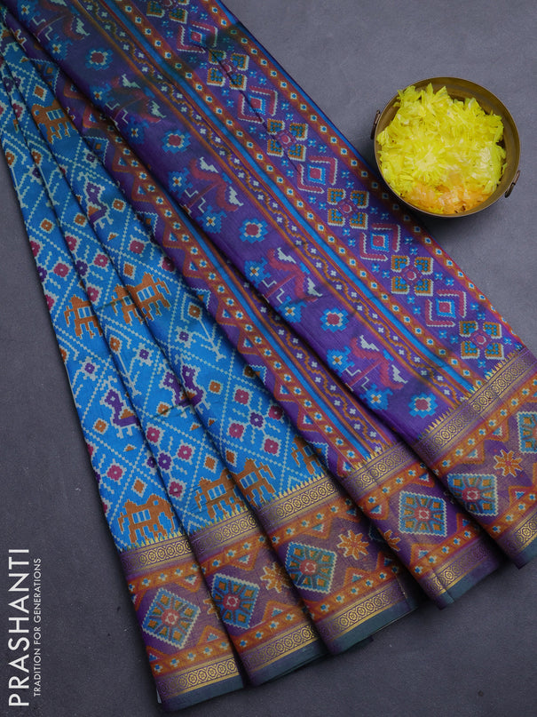 Semi tussar saree cs blue and green with allover patola prints and ikat zari woven border