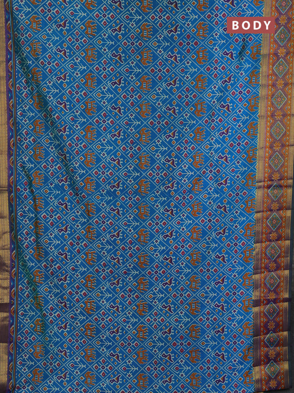 Semi tussar saree cs blue and green with allover patola prints and ikat zari woven border