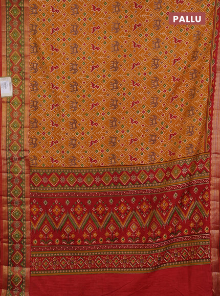 Semi tussar saree mustard yellow and rustic orange with allover patola prints and ikat zari woven border