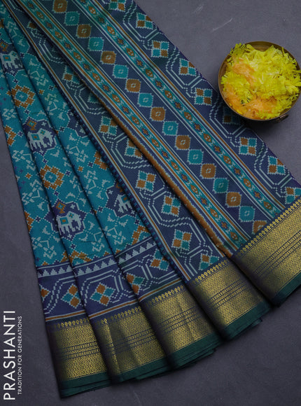 Semi tussar saree blue and green with allover patola prints and zari woven border