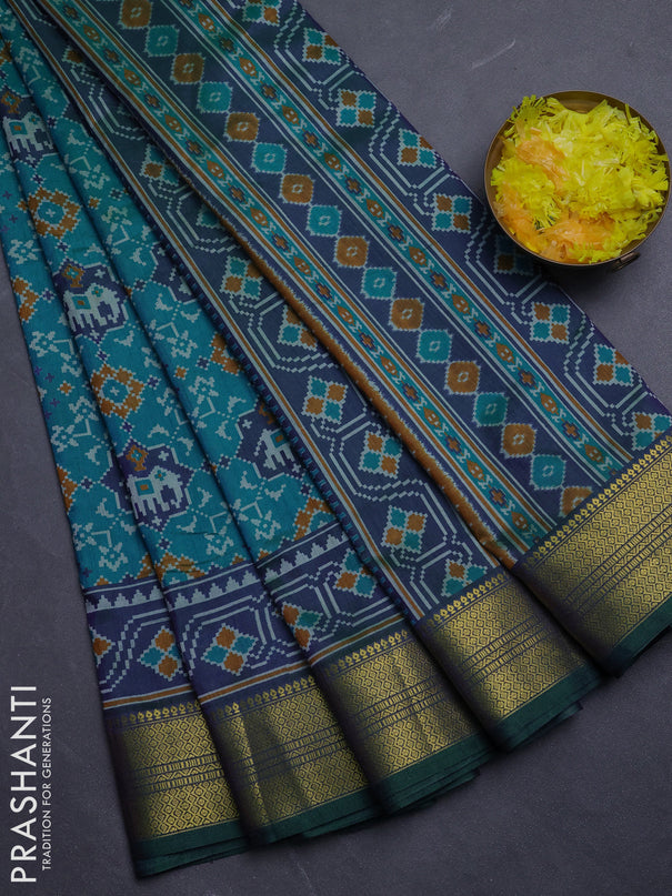 Semi tussar saree blue and green with allover patola prints and zari woven border