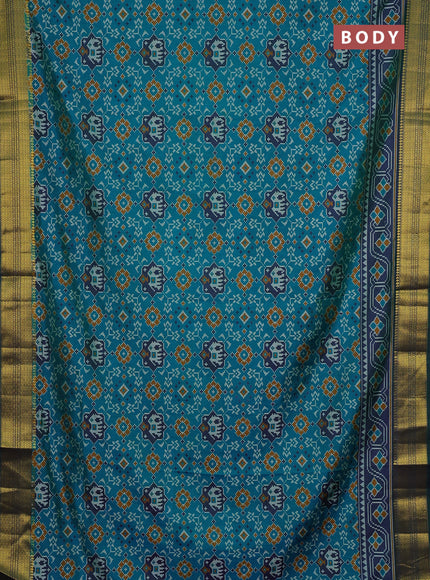 Semi tussar saree blue and green with allover patola prints and zari woven border