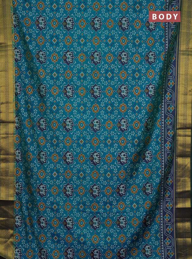 Semi tussar saree blue and green with allover patola prints and zari woven border