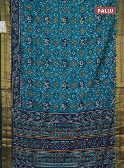 Semi tussar saree blue and green with allover patola prints and zari woven border