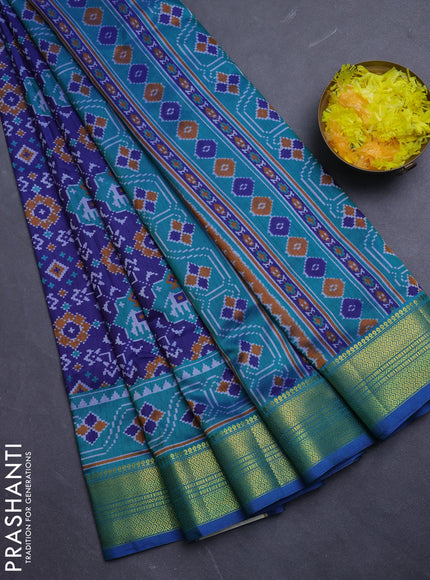 Semi tussar saree blue and teal green with allover patola prints and zari woven border