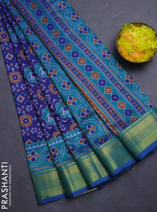 Semi tussar saree blue and teal green with allover patola prints and zari woven border