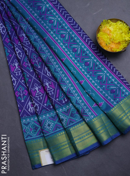 Semi tussar saree navy blue and teal green with allover patola prints and zari woven border