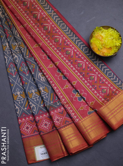 Semi tussar saree grey and orange with allover patola prints and zari woven border