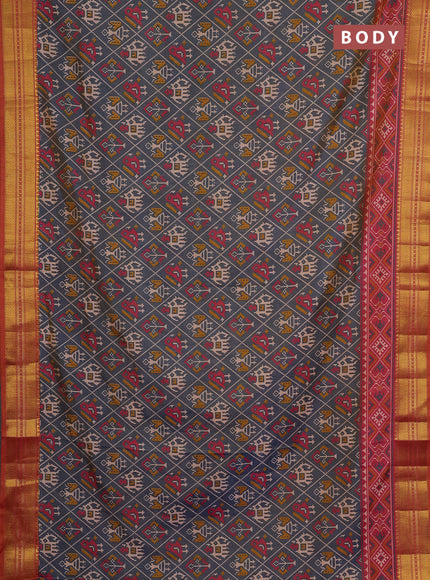 Semi tussar saree grey and orange with allover patola prints and zari woven border