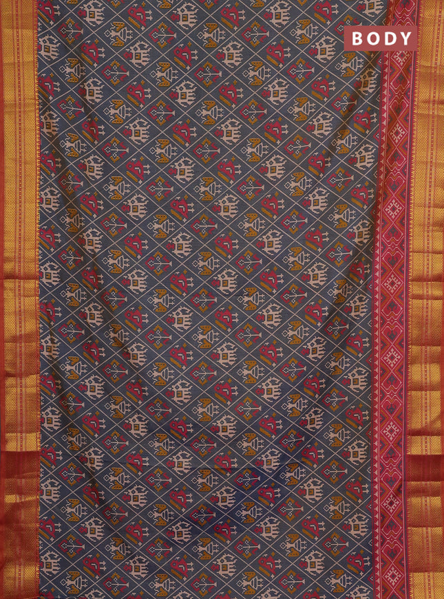 Semi tussar saree grey and orange with allover patola prints and zari woven border