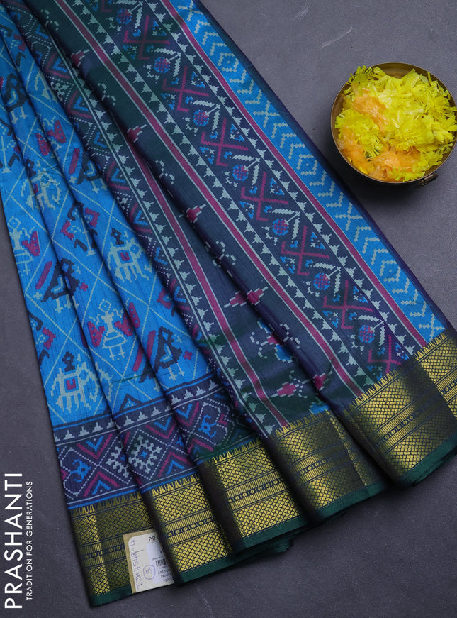 Semi tussar saree dual shade of bluish green and green with allover patola prints and zari woven border