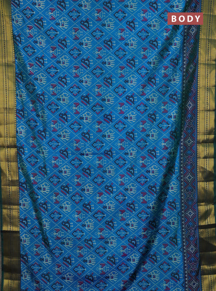 Semi tussar saree dual shade of bluish green and green with allover patola prints and zari woven border