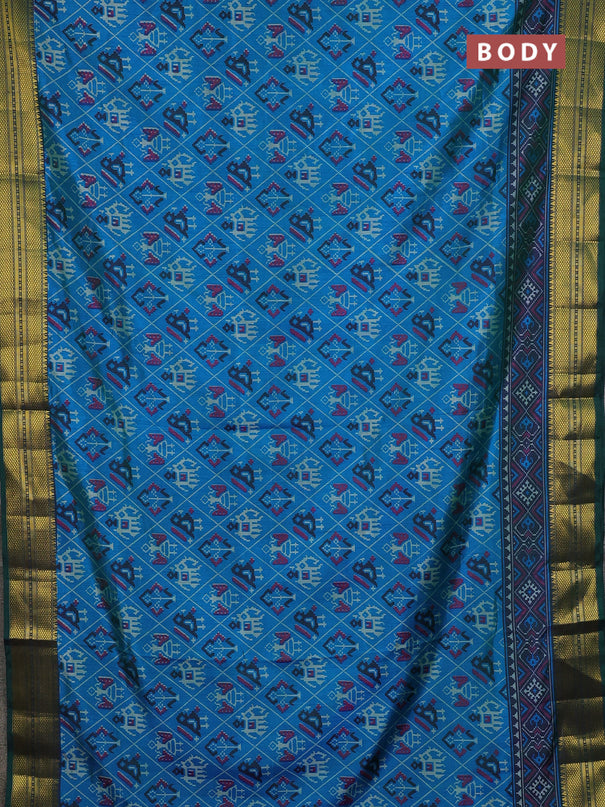 Semi tussar saree dual shade of bluish green and green with allover patola prints and zari woven border