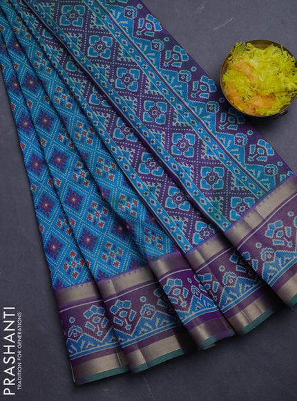 Semi tussar saree dual shade of bluish green and purple with allover ikat prints and ikat zari woven border