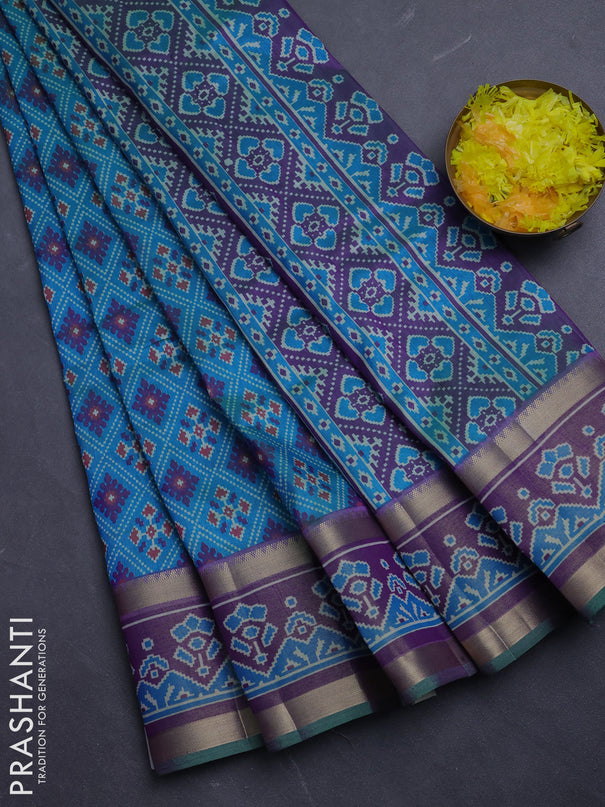 Semi tussar saree dual shade of bluish green and purple with allover ikat prints and ikat zari woven border
