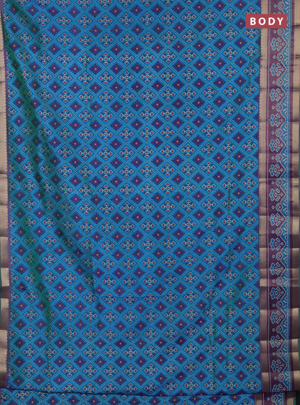Semi tussar saree dual shade of bluish green and purple with allover ikat prints and ikat zari woven border