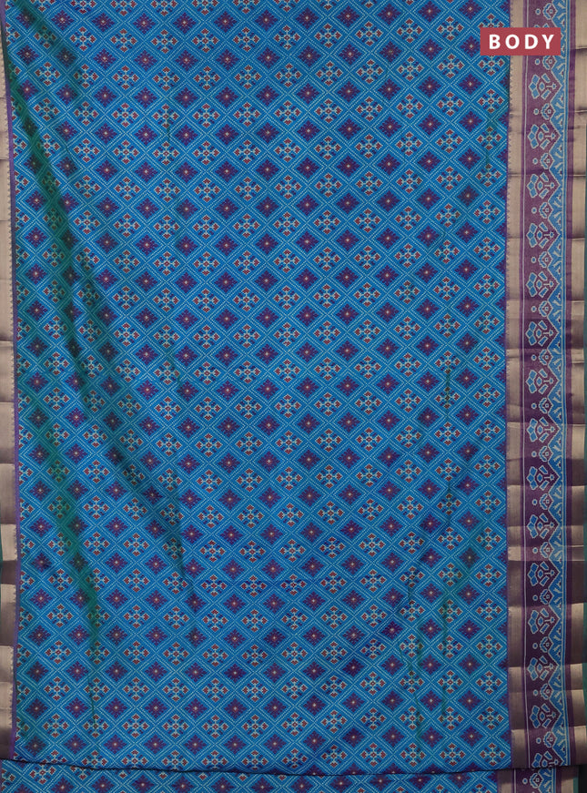 Semi tussar saree dual shade of bluish green and purple with allover ikat prints and ikat zari woven border