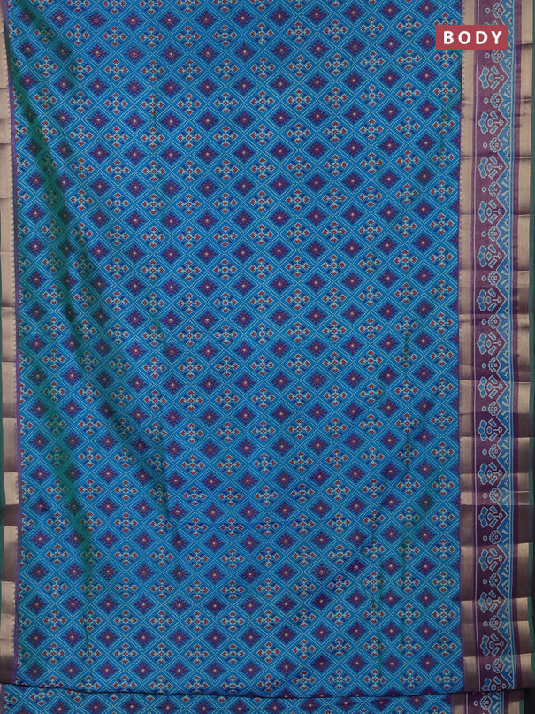 Semi tussar saree dual shade of bluish green and purple with allover ikat prints and ikat zari woven border